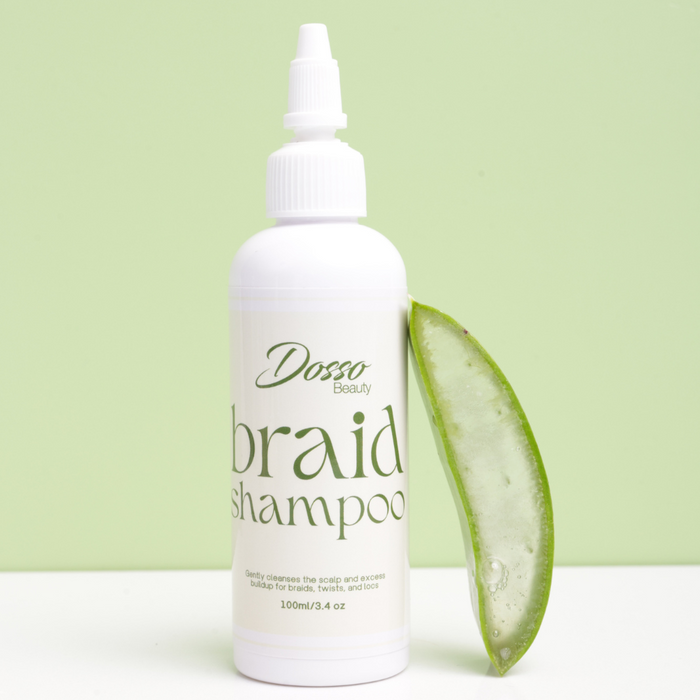 Dosso Beauty braid shampoo bottle with aloe vera leaf on a light green background