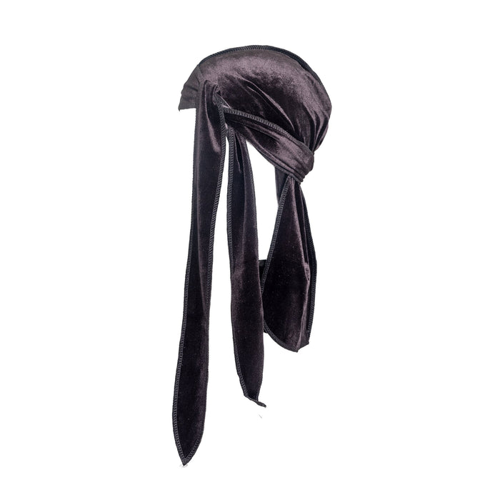 Side shot of a black velvet DuRag, styled as though it is on a person's head.